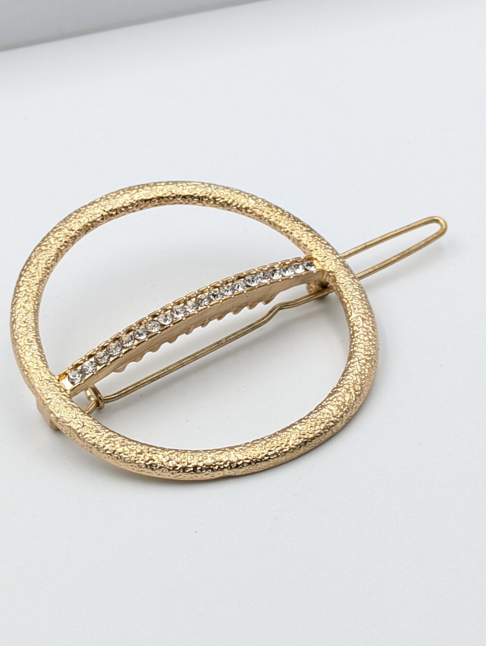 Gold tone and rhinestone fancy hair clip accessory